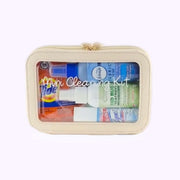 Mini cleaning kit with various cleaning products inside a beige case on a white background