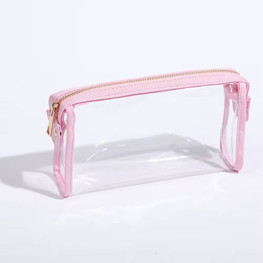 Clear pouch cosmetic bag with pink zipper on a white background